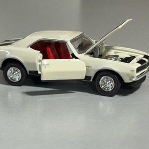 Sleek White Toy Car with Red Interior